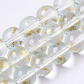 Spray Painted  with Gold 36-40 beads per strand.